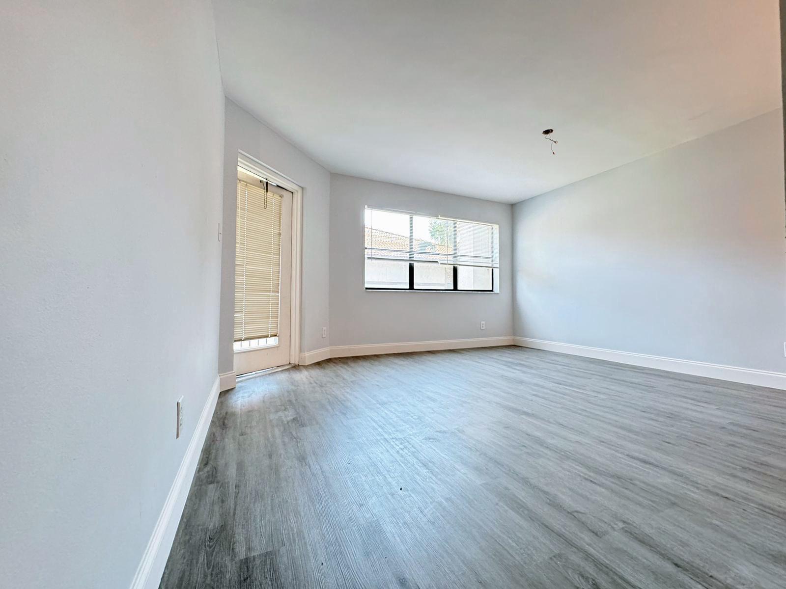 540 South Park Road Hollywood, FL 33021 - Photo 23 of 26 an empty room with wooden floor and windows
