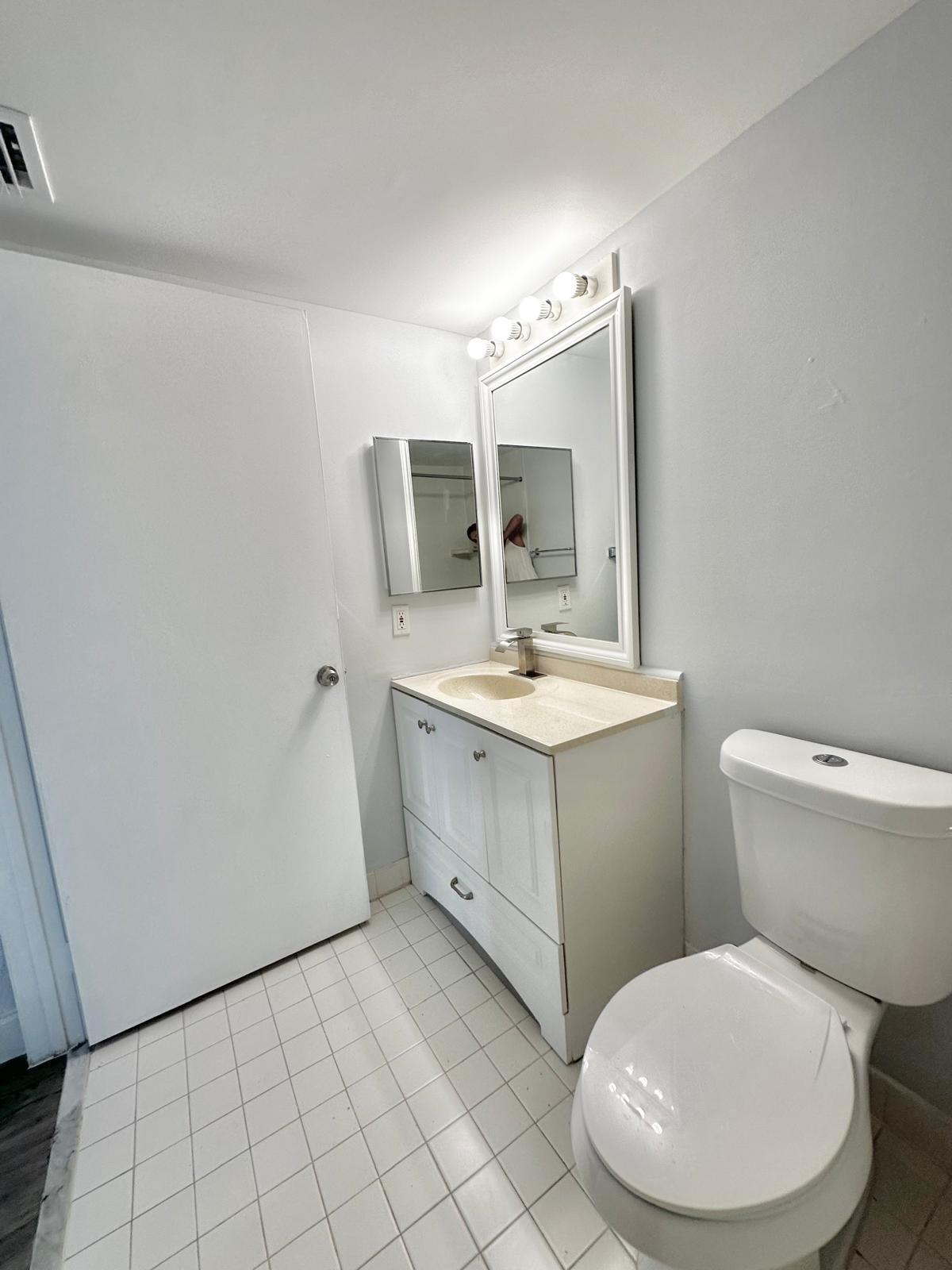 540 South Park Road Hollywood, FL 33021 - Photo 24 of 26 a bathroom with a toilet sink and mirror
