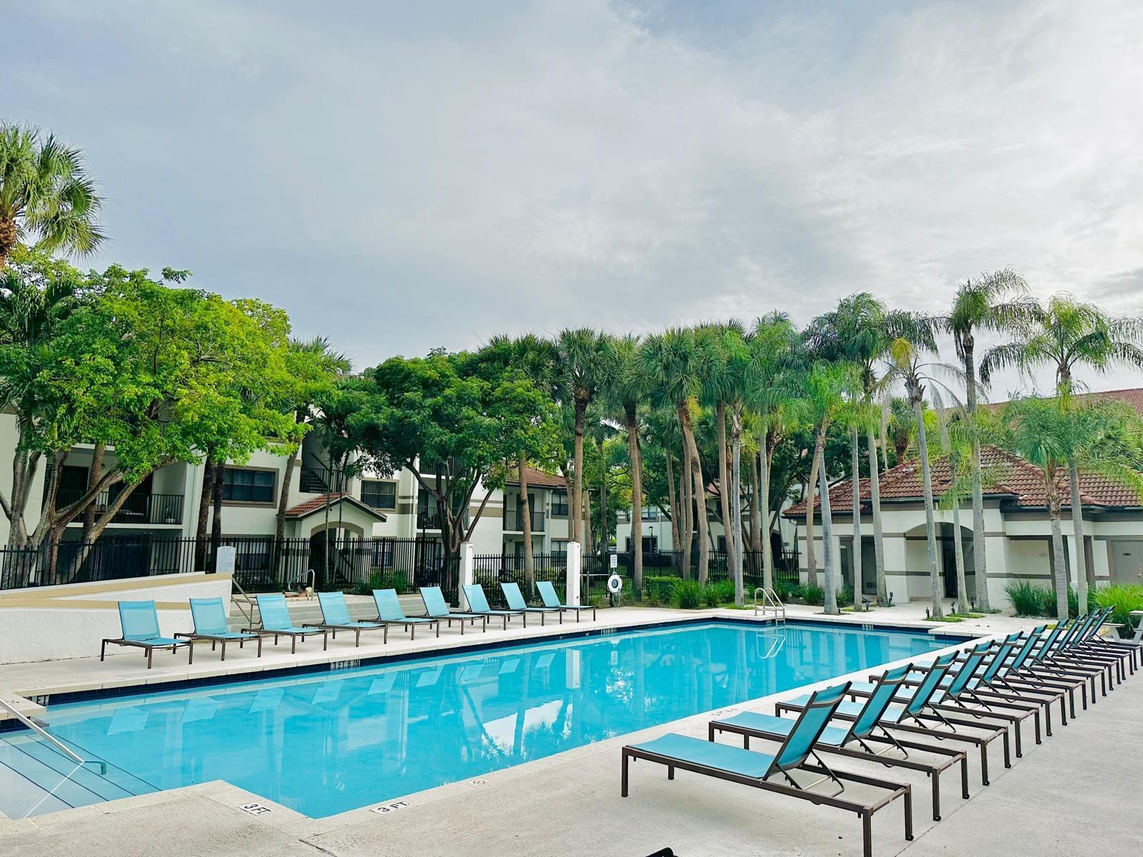 540 South Park Road Hollywood, FL 33021 - Photo 4 of 26 a view of a swimming pool with chairs