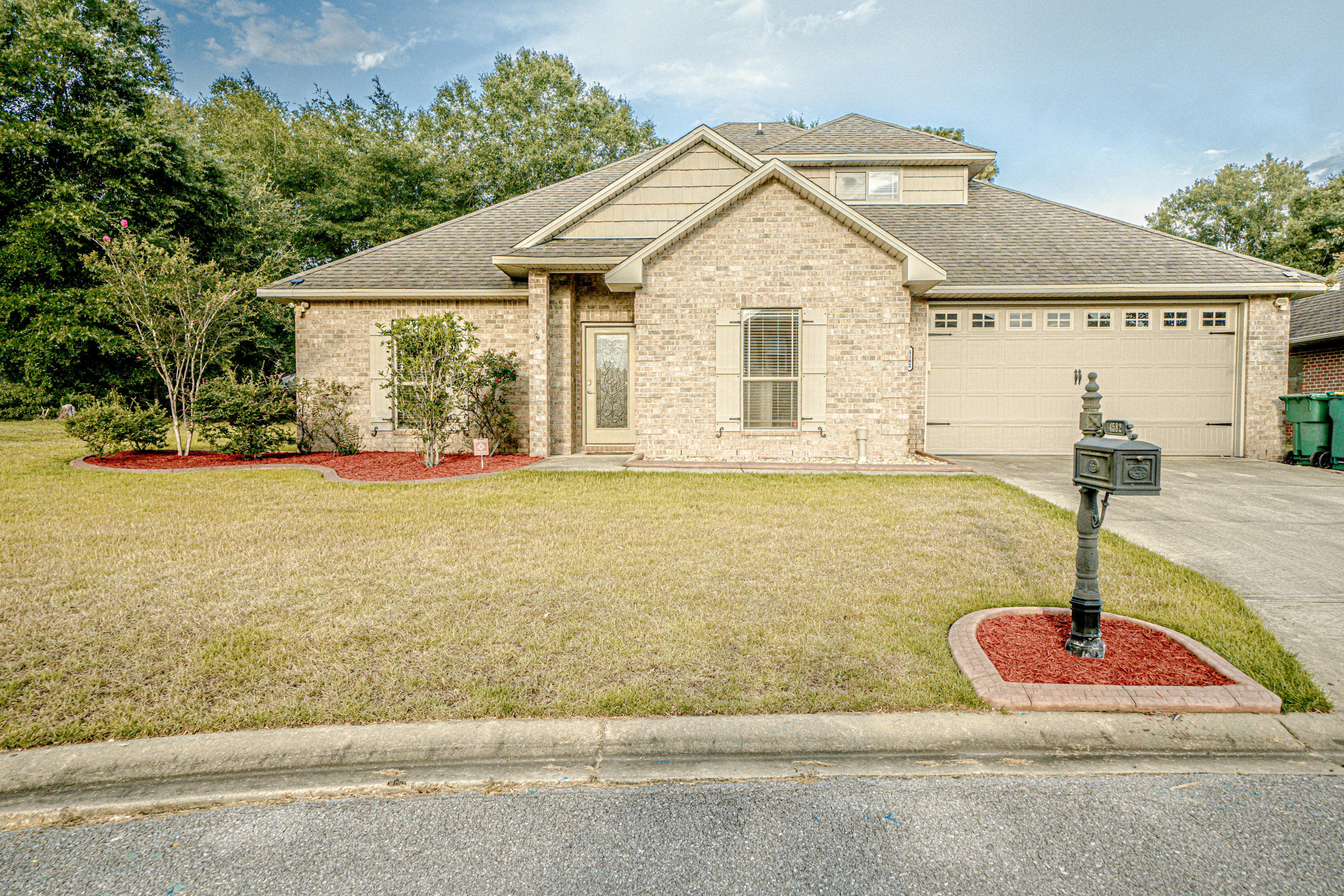 4582 Hermosa Road Crestview, FL 32539 - Photo 1 of 26 a front view of a house with a yard