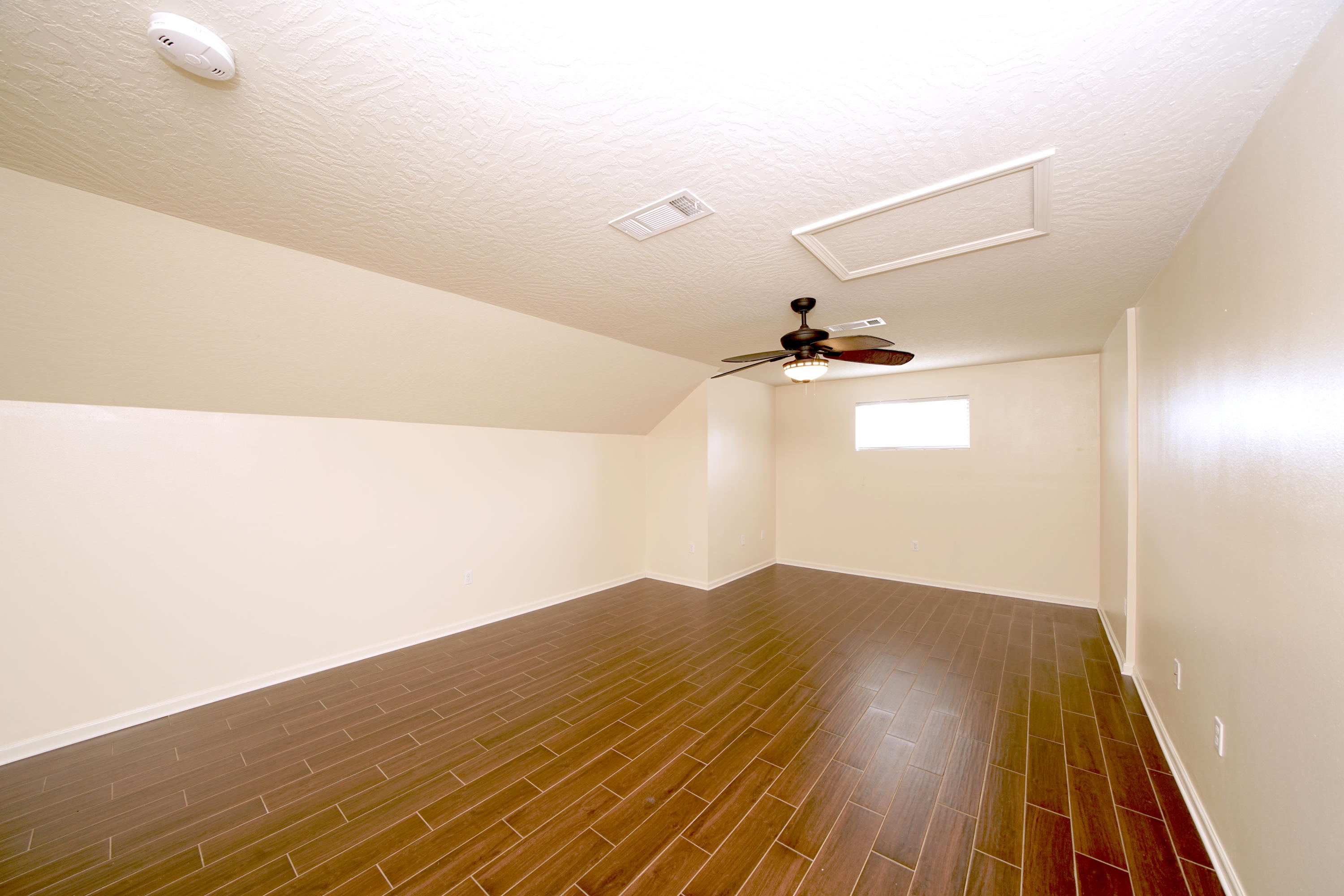 4582 Hermosa Road Crestview, FL 32539 - Photo 18 of 26 a view of a big room with wooden floor