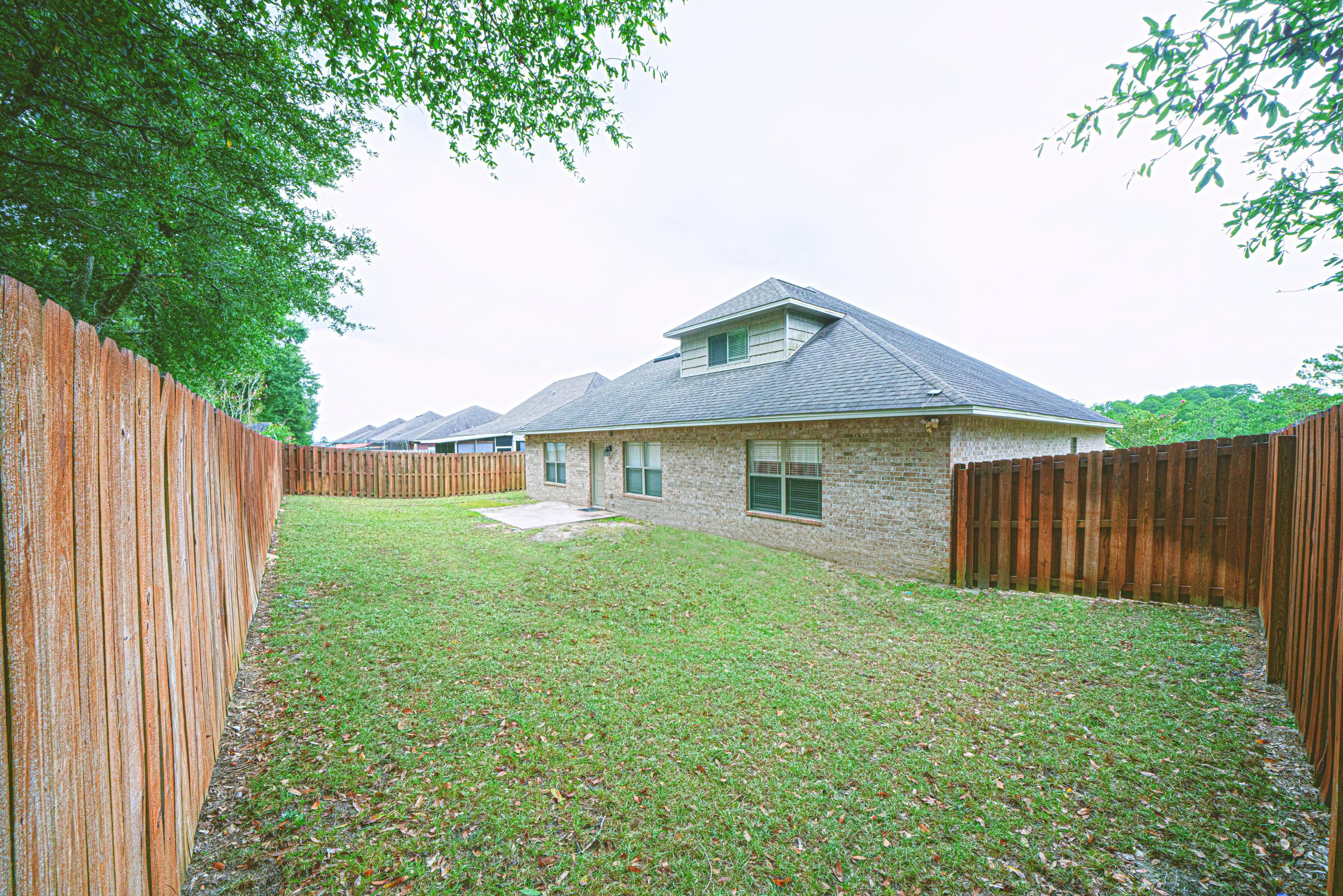 4582 Hermosa Road Crestview, FL 32539 - Photo 25 of 26 a front view of a house with garden