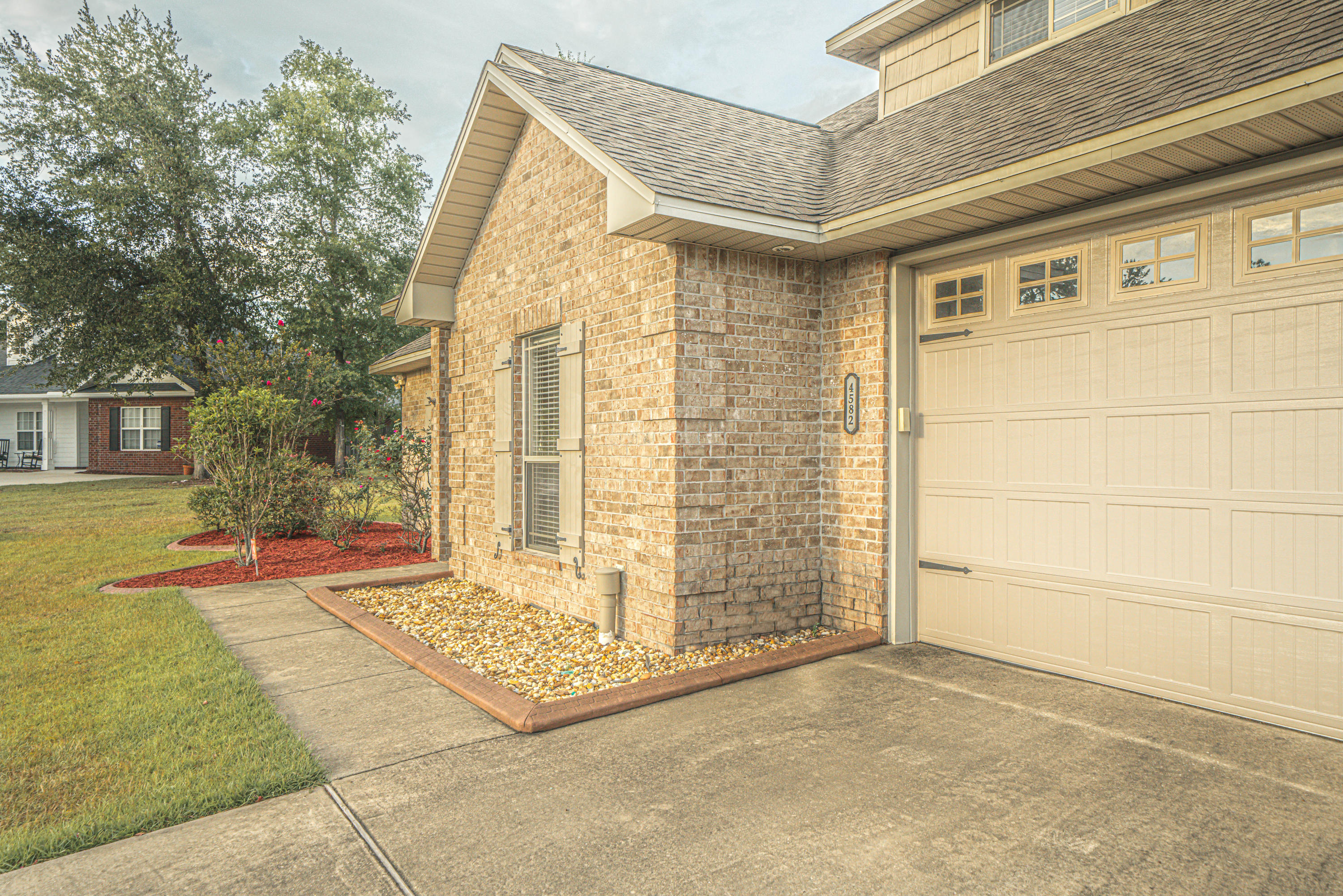 4582 Hermosa Road Crestview, FL 32539 - Photo 3 of 26 front view of a house with a outdoor space
