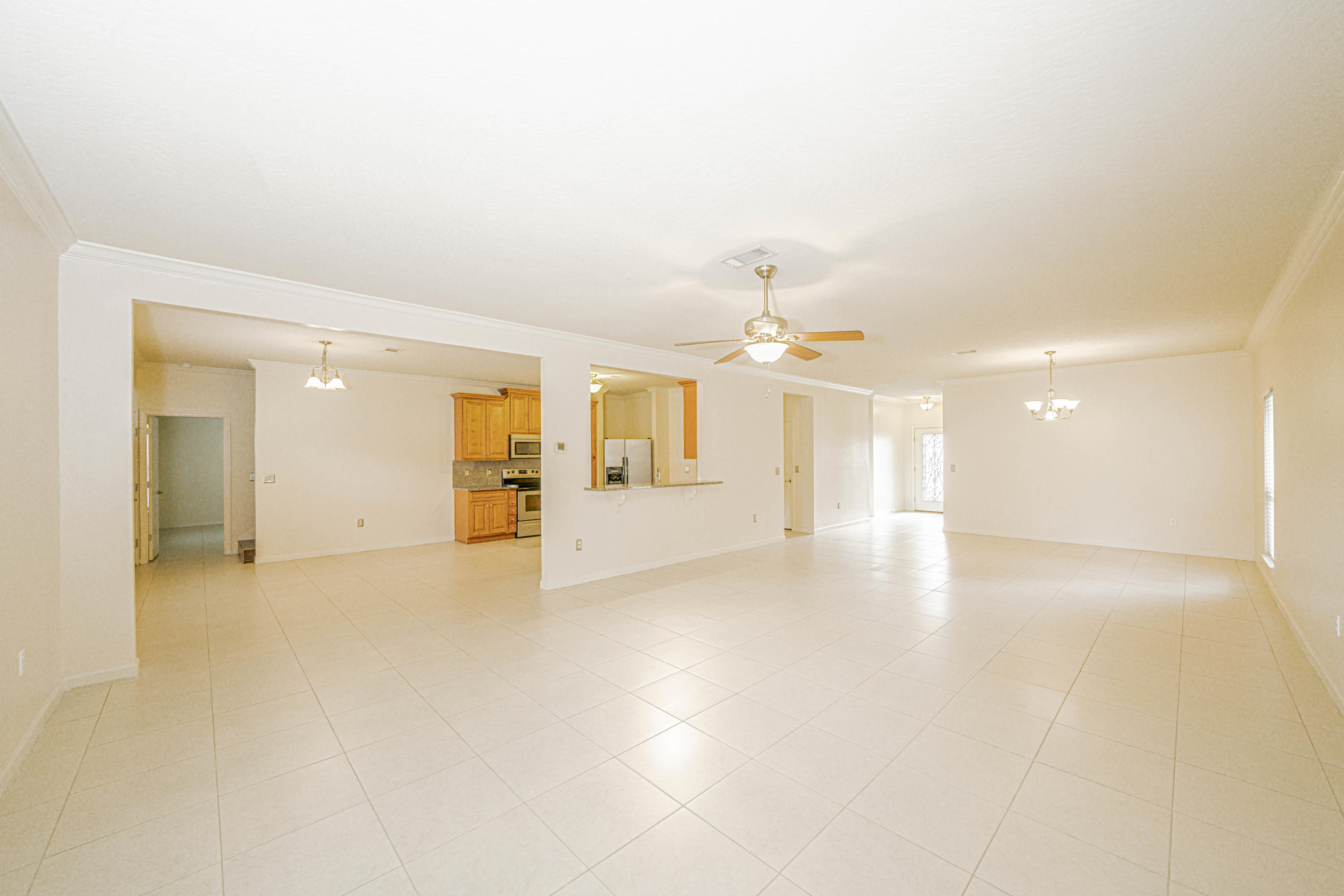 4582 Hermosa Road Crestview, FL 32539 - Photo 9 of 26 an empty room with a kitchen and a sink