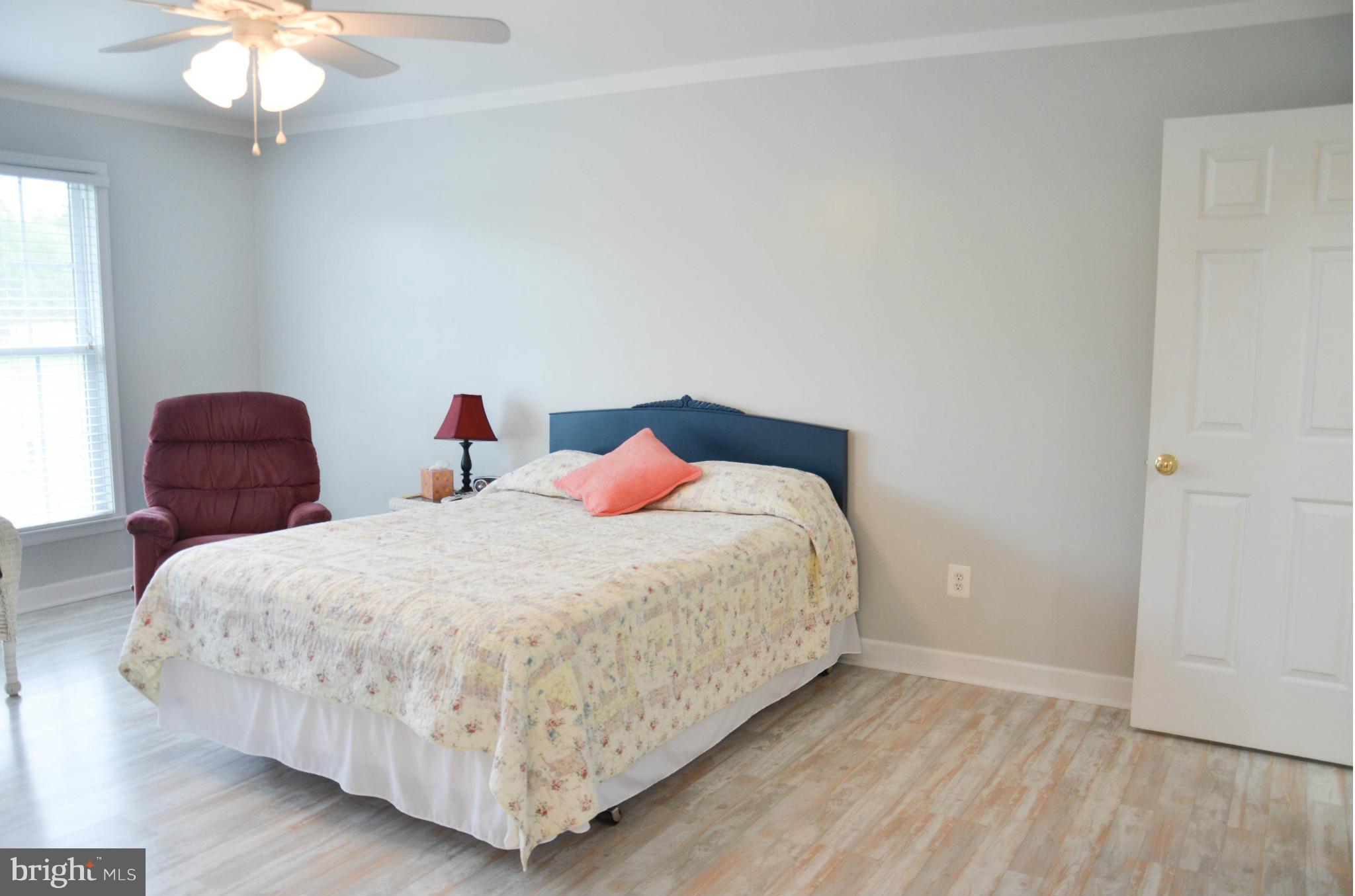 21021 Batna Road Culpeper, VA 22701 - Photo 13 of 30 Master with ceiling fan and view of back yard