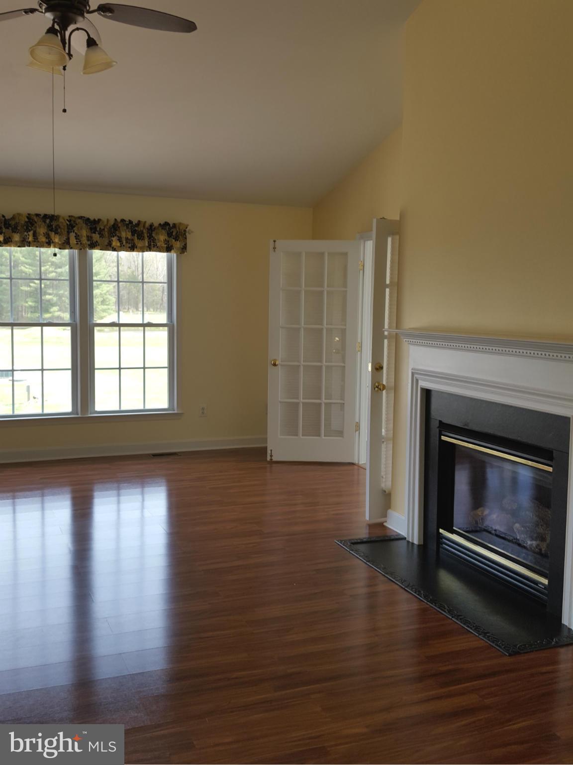 21021 Batna Road Culpeper, VA 22701 - Photo 10 of 30 Family room w/ fireplace and vaulted ceilings