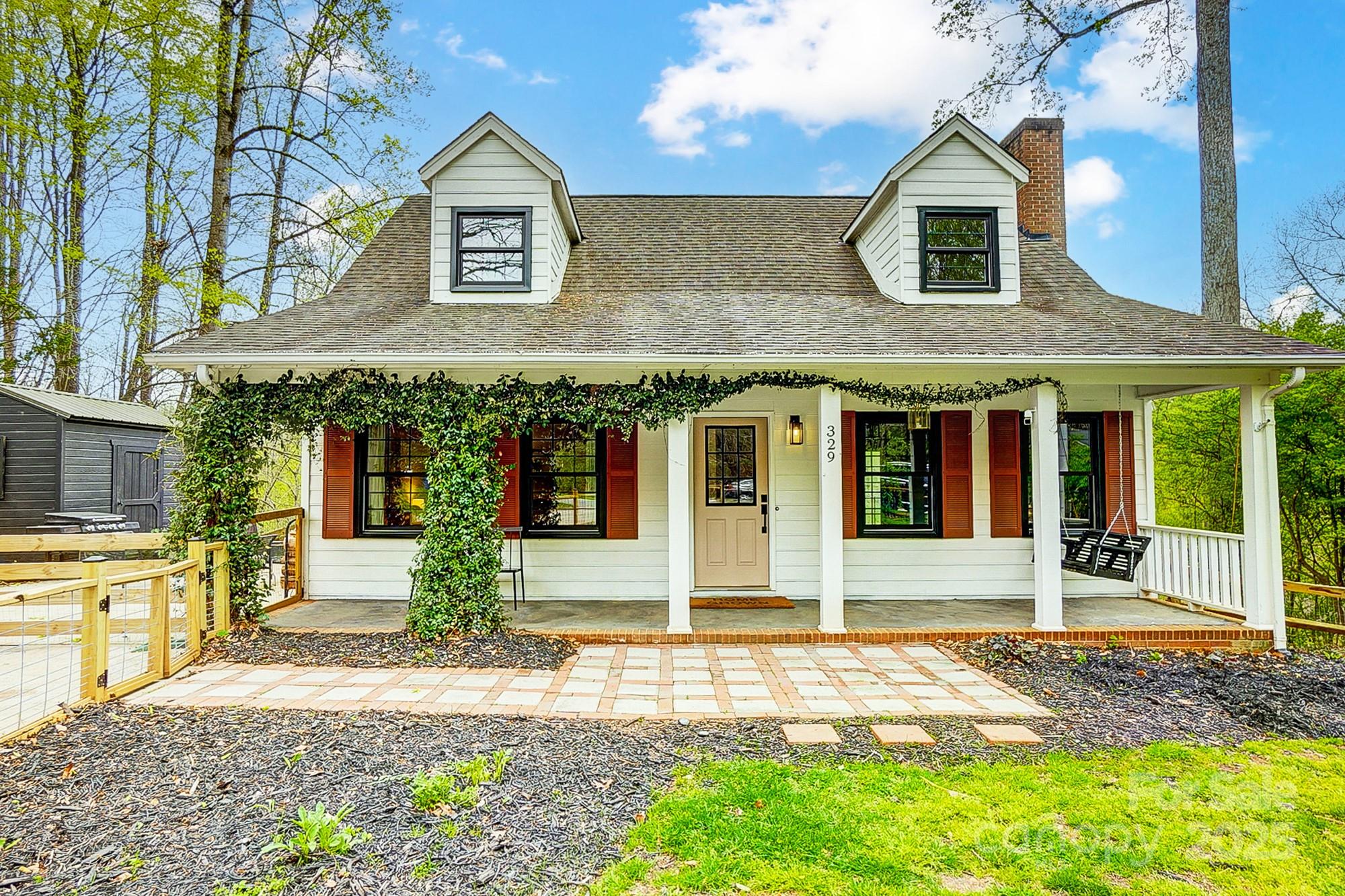 a view of a brick house with a large windows