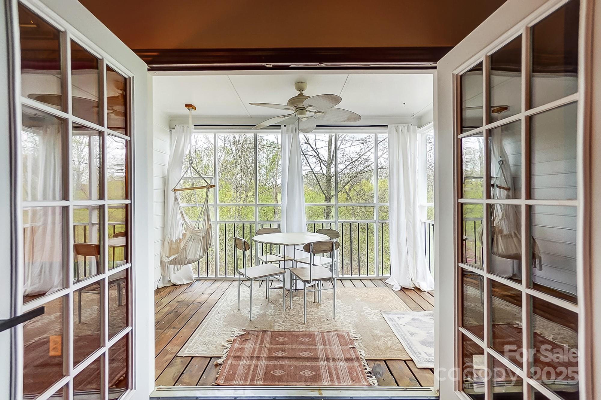329 Treeline Drive Belmont, NC 28012 - Photo 12 of 48 a living room with a large window and dining table