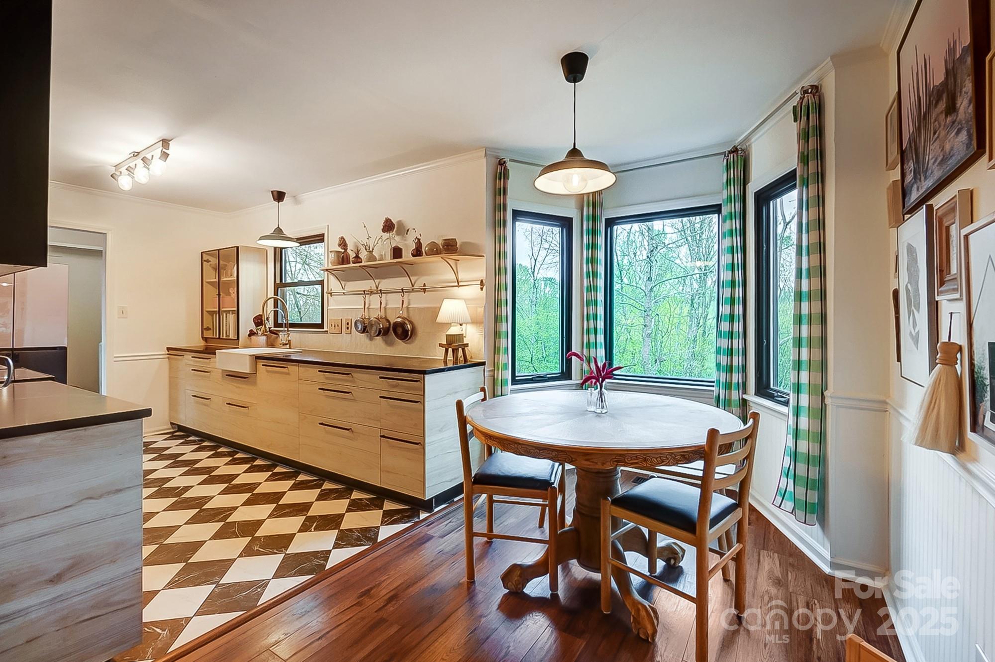 329 Treeline Drive Belmont, NC 28012 - Photo 15 of 48 a kitchen with stainless steel appliances a dining table chairs and wooden floor