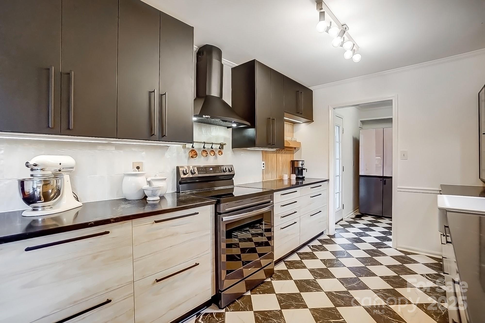 329 Treeline Drive Belmont, NC 28012 - Photo 18 of 48 a kitchen with stainless steel appliances a sink stove refrigerator and cabinets