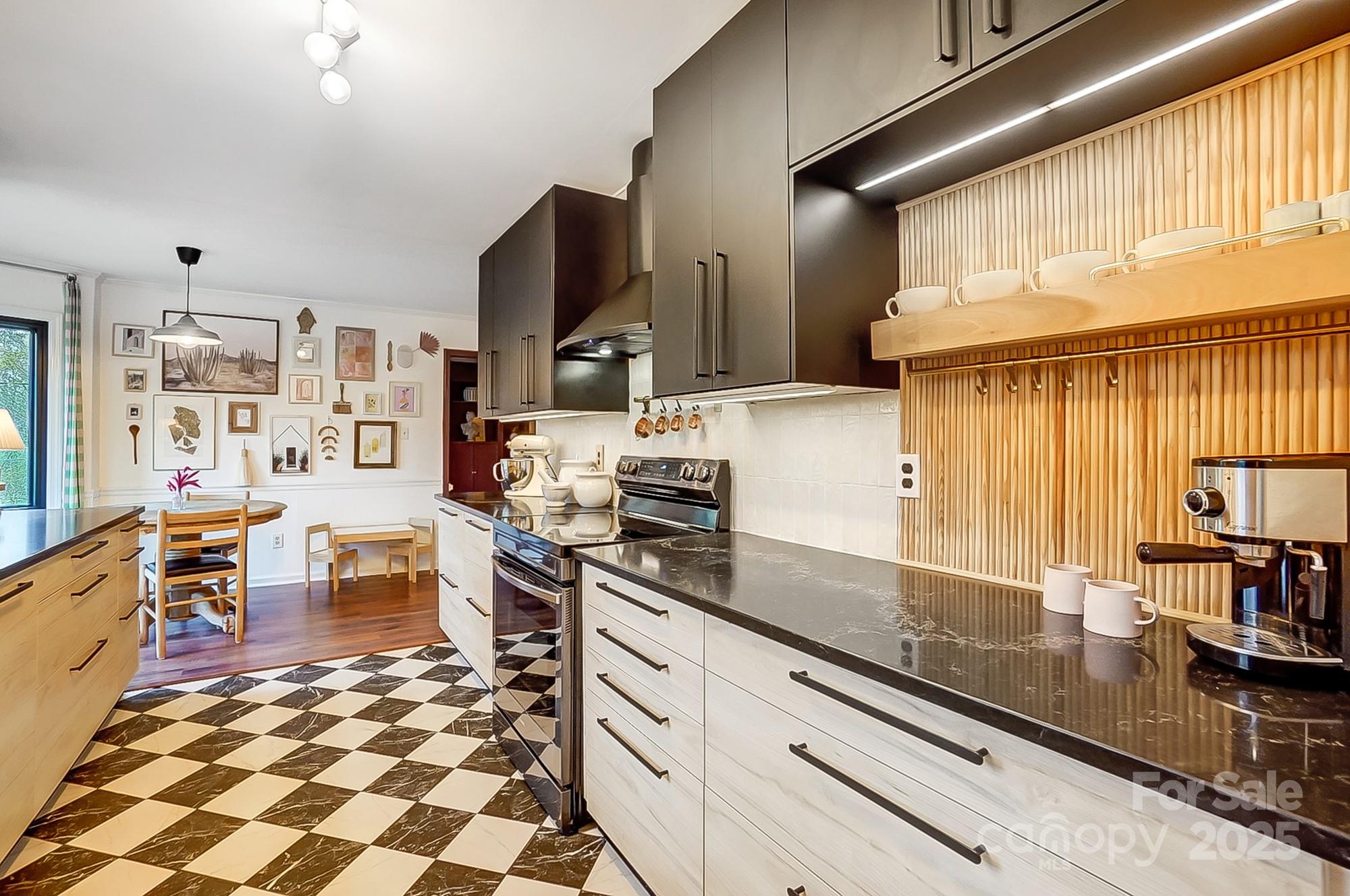 329 Treeline Drive Belmont, NC 28012 - Photo 22 of 48 a kitchen with stainless steel appliances a sink a stove and cabinets