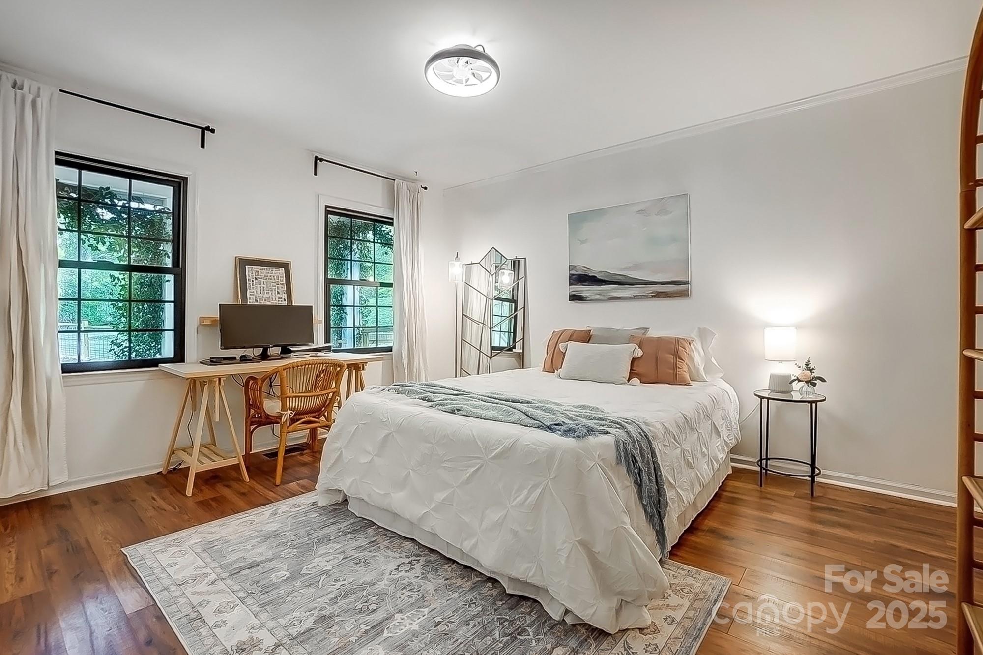 329 Treeline Drive Belmont, NC 28012 - Photo 26 of 48 a bedroom with a bed and wooden floor