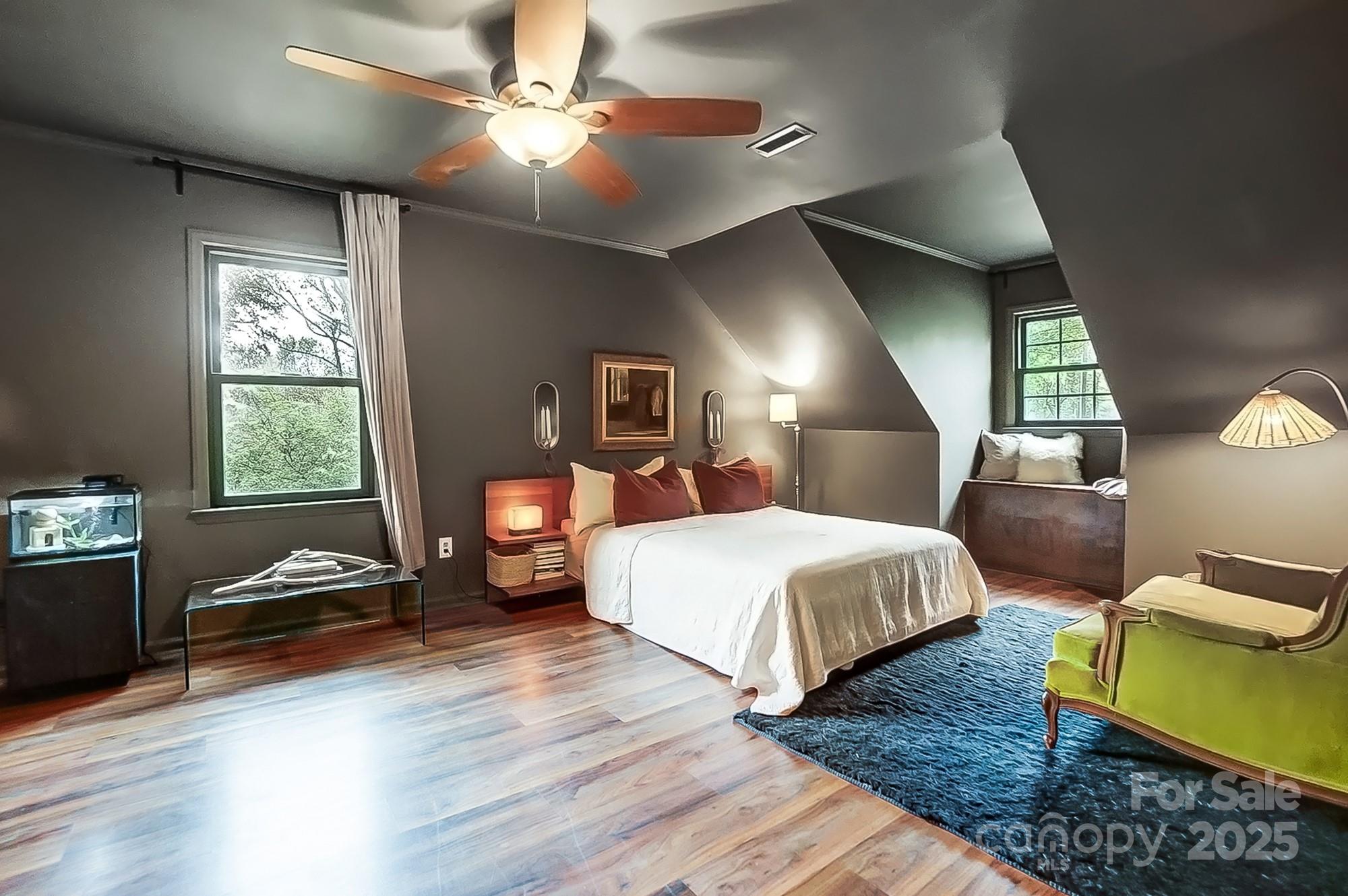 329 Treeline Drive Belmont, NC 28012 - Photo 30 of 48 a spacious bedroom with a bed a couch and a chandelier