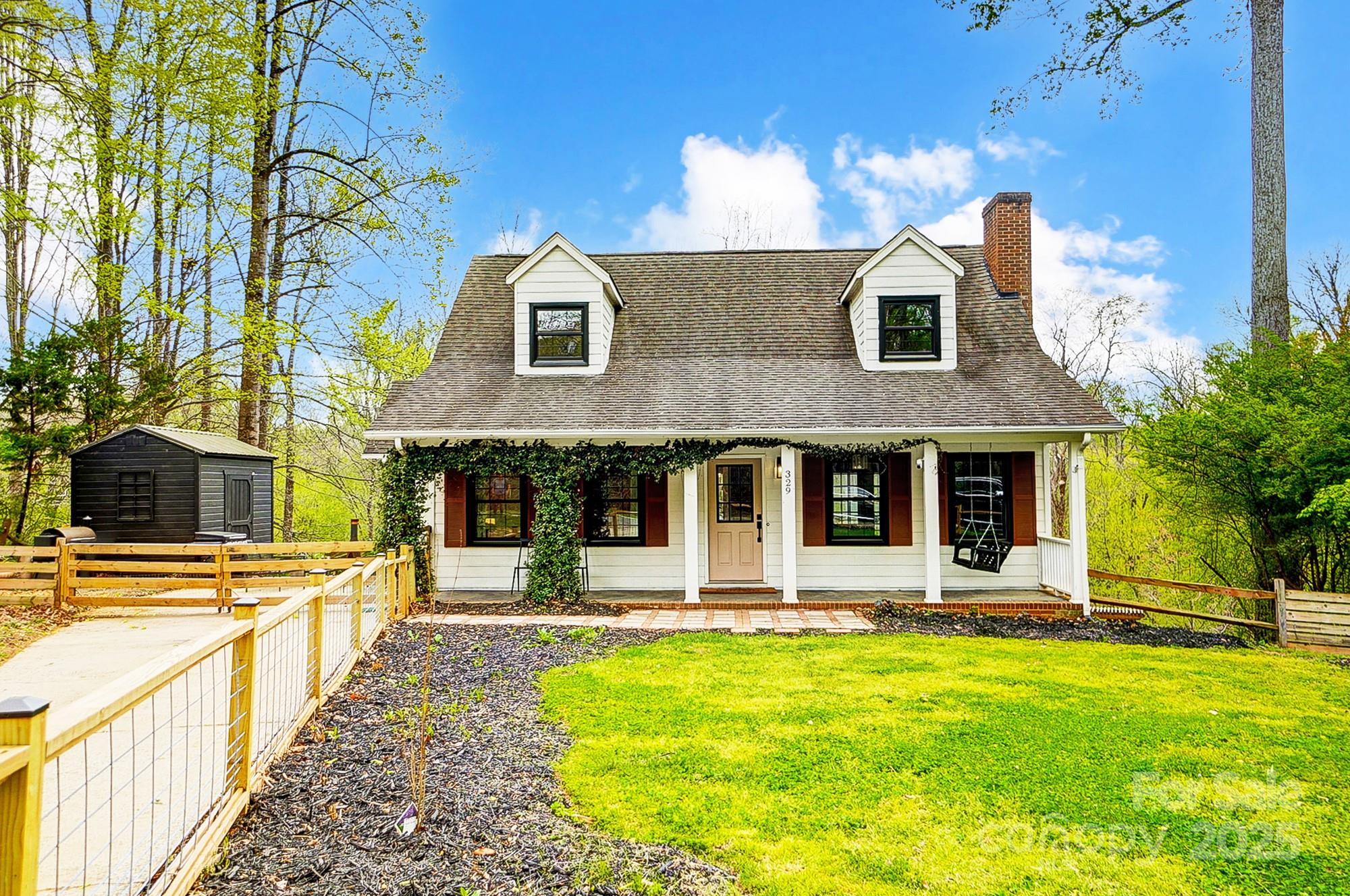 329 Treeline Drive Belmont, NC 28012 - Photo 3 of 48 a front view of a house with swimming pool