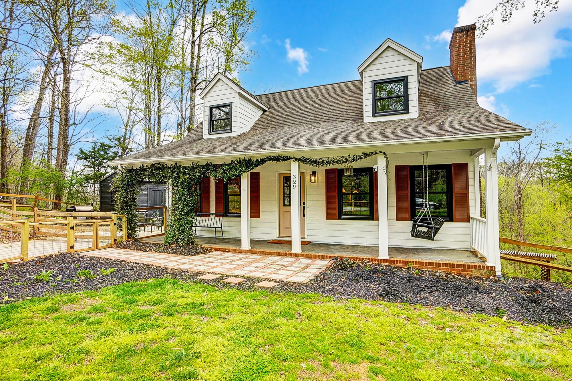 329 Treeline Drive Belmont, NC 28012 - Photo 4 of 48 a front view of a house with a yard