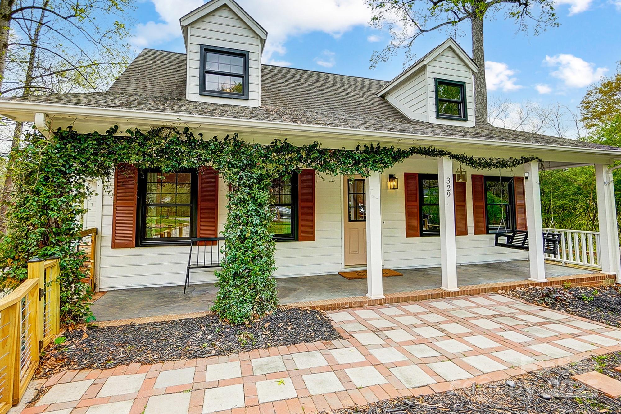 329 Treeline Drive Belmont, NC 28012 - Photo 5 of 48 a front view of a house with garden