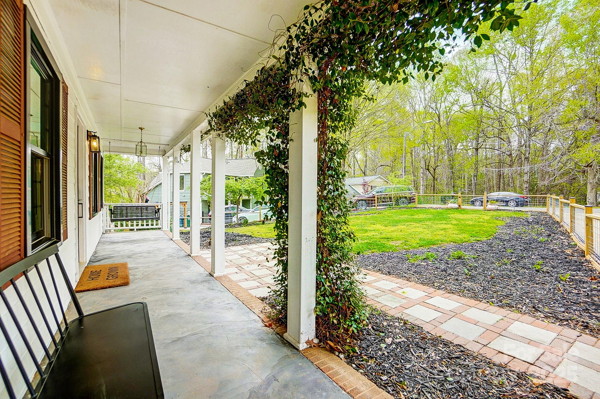 329 Treeline Drive Belmont, NC 28012 - Photo 7 of 48 a view of a porch with furniture and garden