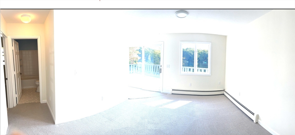 81 Jolicoeur Avenue, Unit B Spencer, MA 01562 - Photo 7 of 8 a view of a room with a door