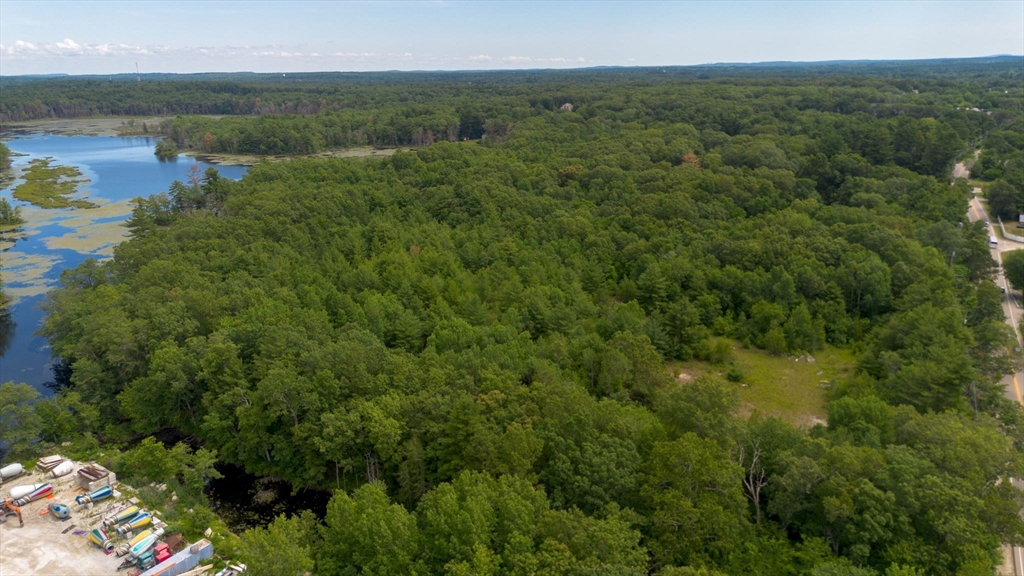 0 Hartford Avenue Bellingham, MA 02019 - Photo 9 of 15 a view of a lake with a yard and mountain view