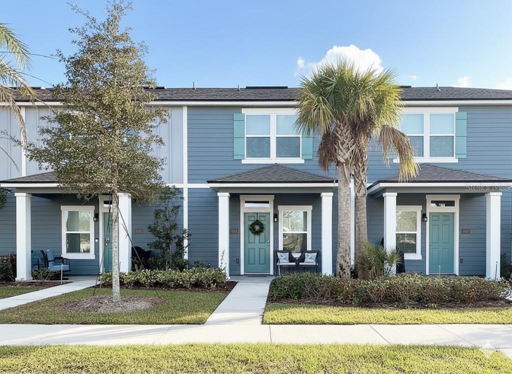 a front view of a house with garden