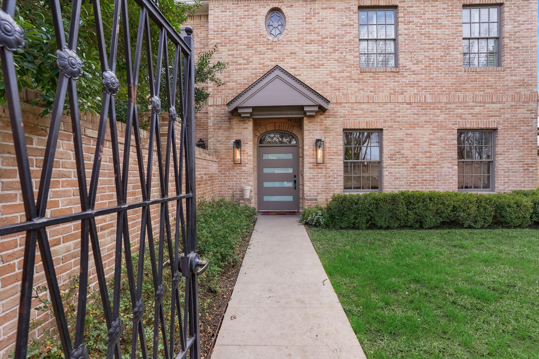 3705 Gilbert Street, Unit B Austin, TX 78703 - Photo 2 of 35 Doorway to property with a yard and brick siding