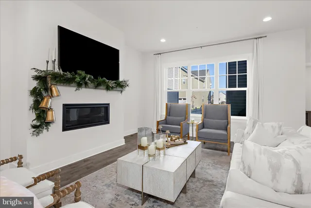 a kitchen with a stove and wooden floor