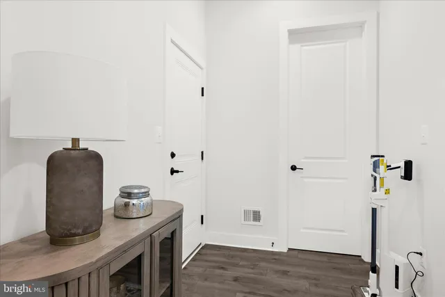 a view of a room with furniture and windows