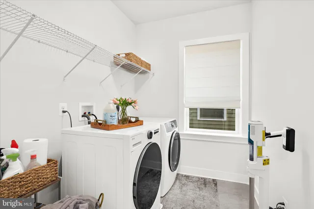 a bathroom with a double vanity sink mirror and shower