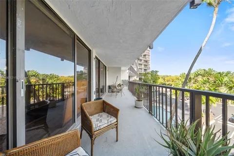 a view of balcony with furniture
