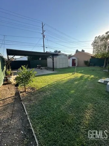 a view of a backyard of the house