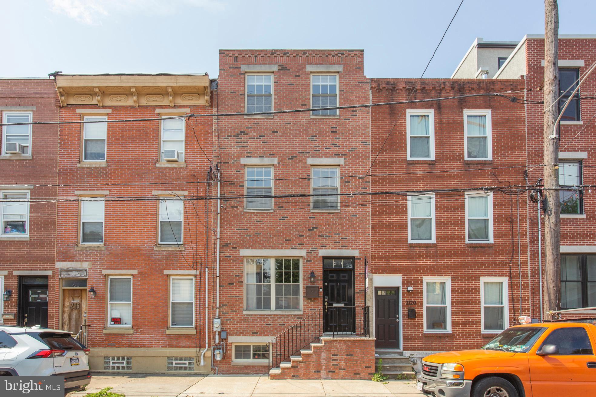 2118 Ellsworth Street Philadelphia, PA 19146 - Photo 2 of 32 a front view of a building with many windows