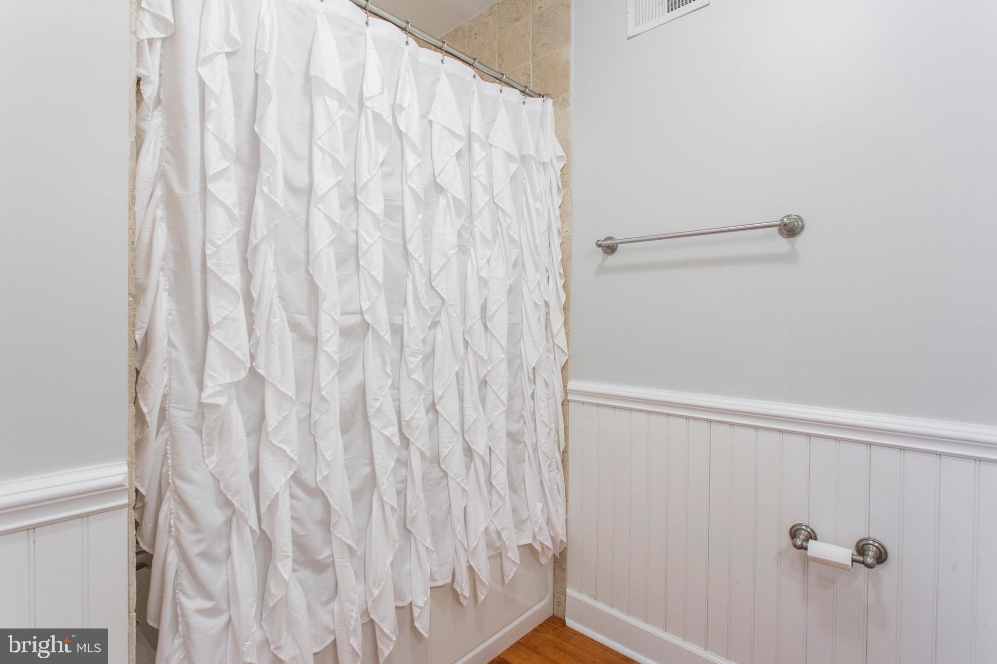 2118 Ellsworth Street Philadelphia, PA 19146 - Photo 14 of 32 a bathroom with a shower curtain