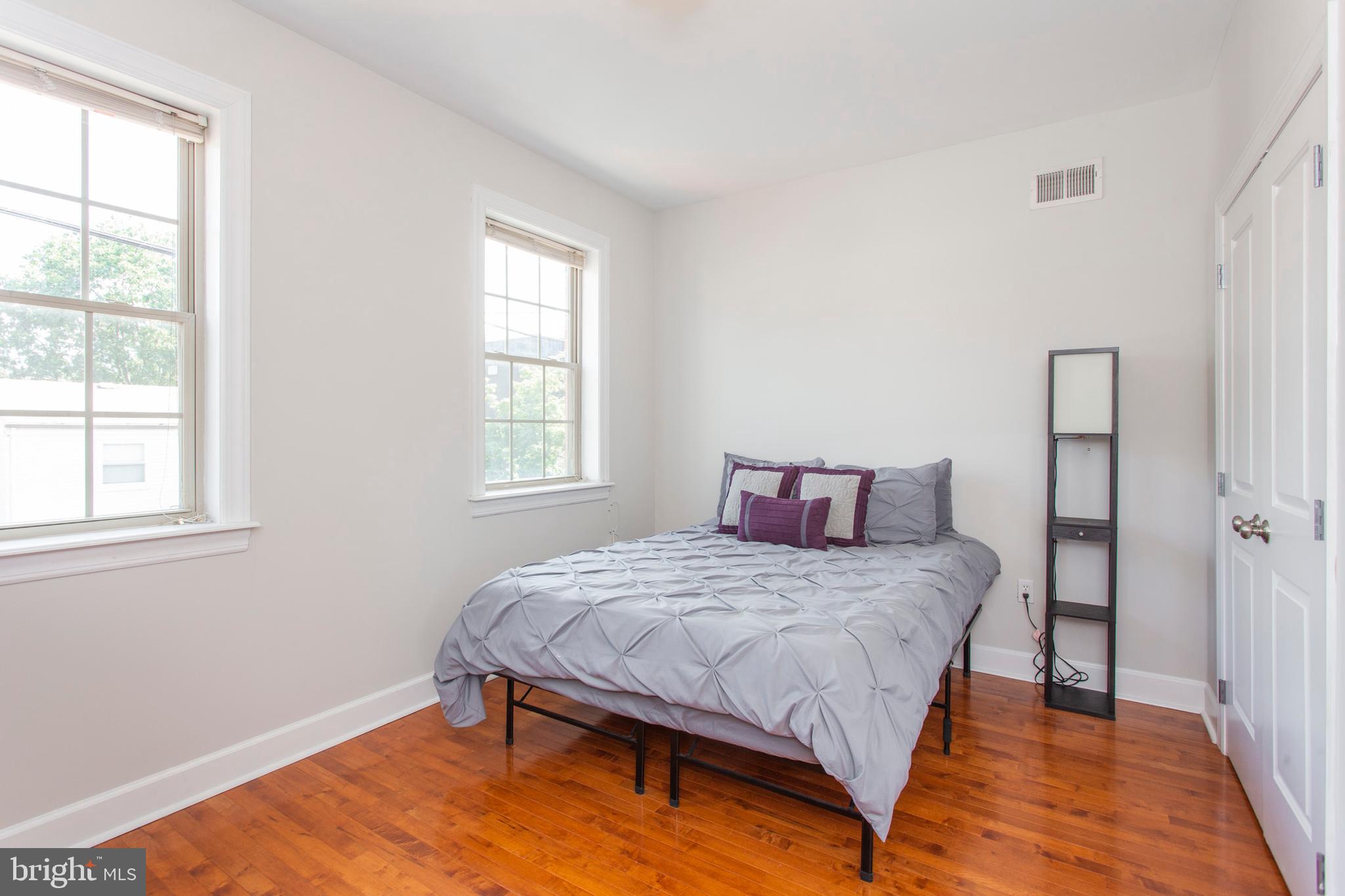 2118 Ellsworth Street Philadelphia, PA 19146 - Photo 16 of 32 a bedroom with a bed and window