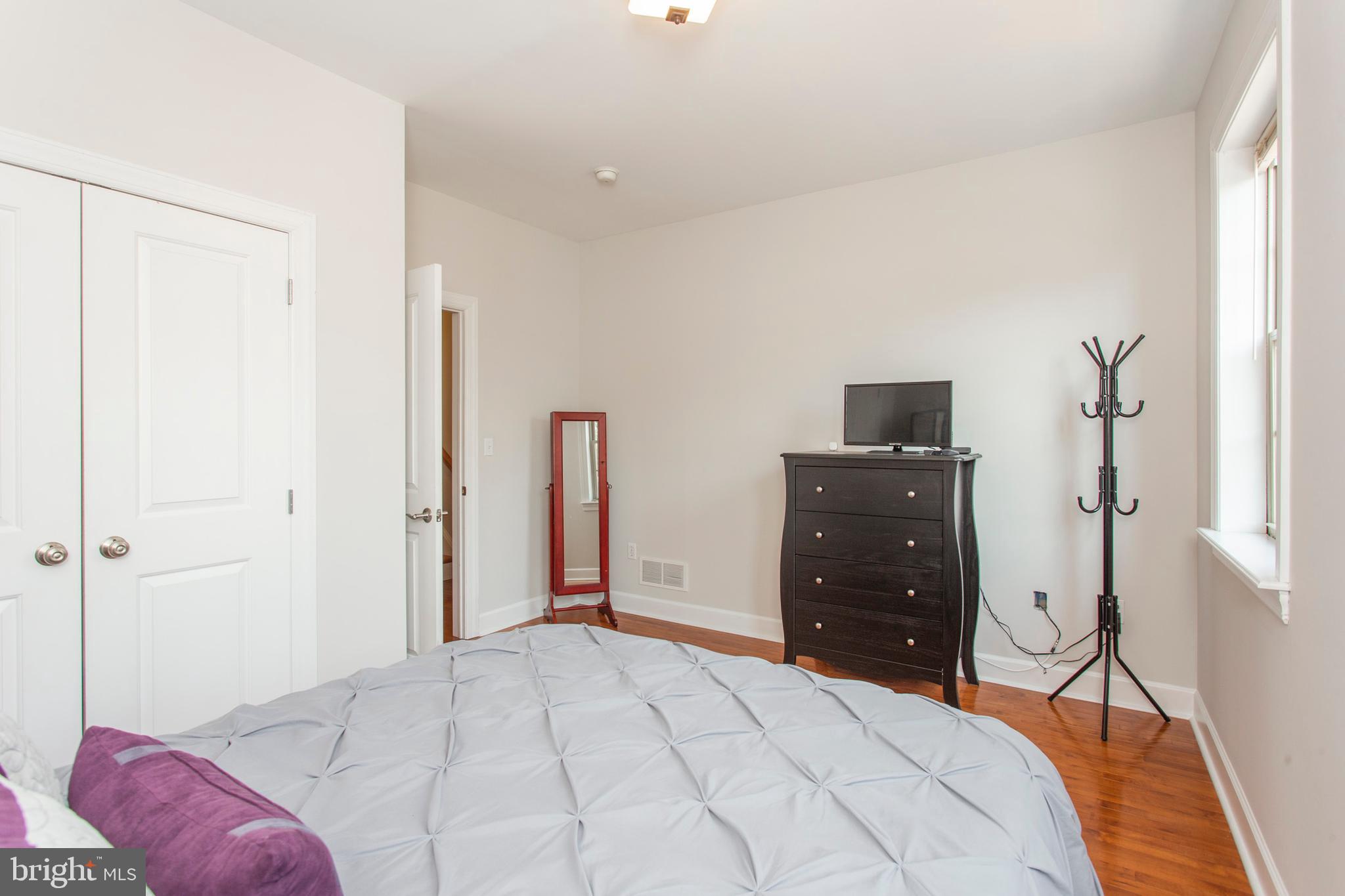 2118 Ellsworth Street Philadelphia, PA 19146 - Photo 17 of 32 a bedroom with a bed and a dresser