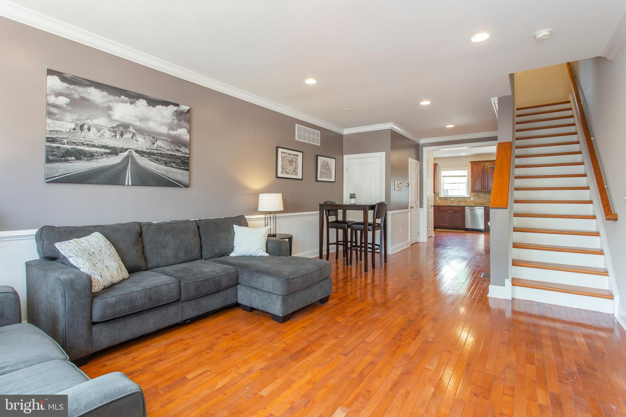 2118 Ellsworth Street Philadelphia, PA 19146 - Photo 3 of 32 a living room with furniture and wooden floor