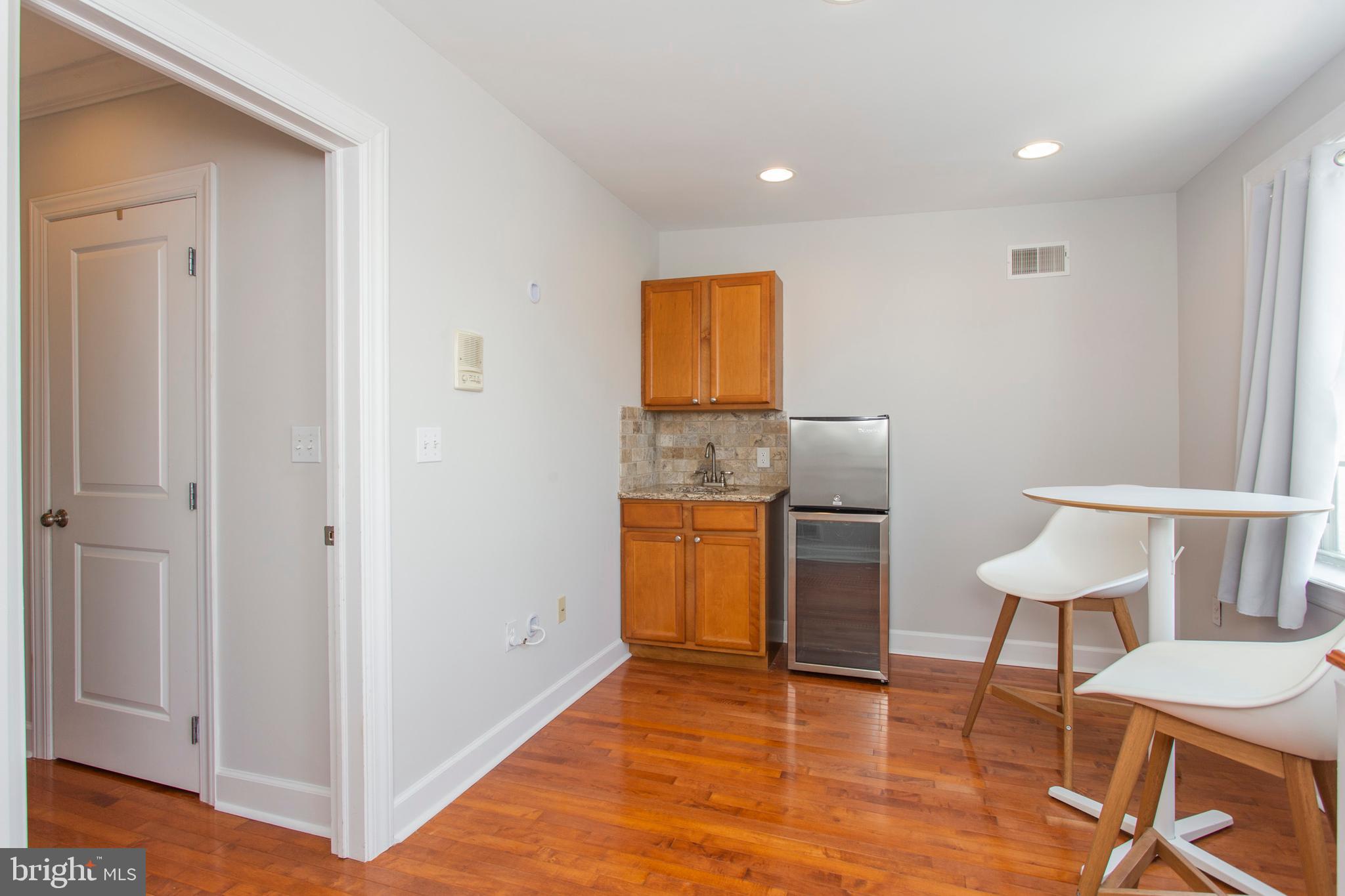 2118 Ellsworth Street Philadelphia, PA 19146 - Photo 24 of 32 a room with a table and chairs