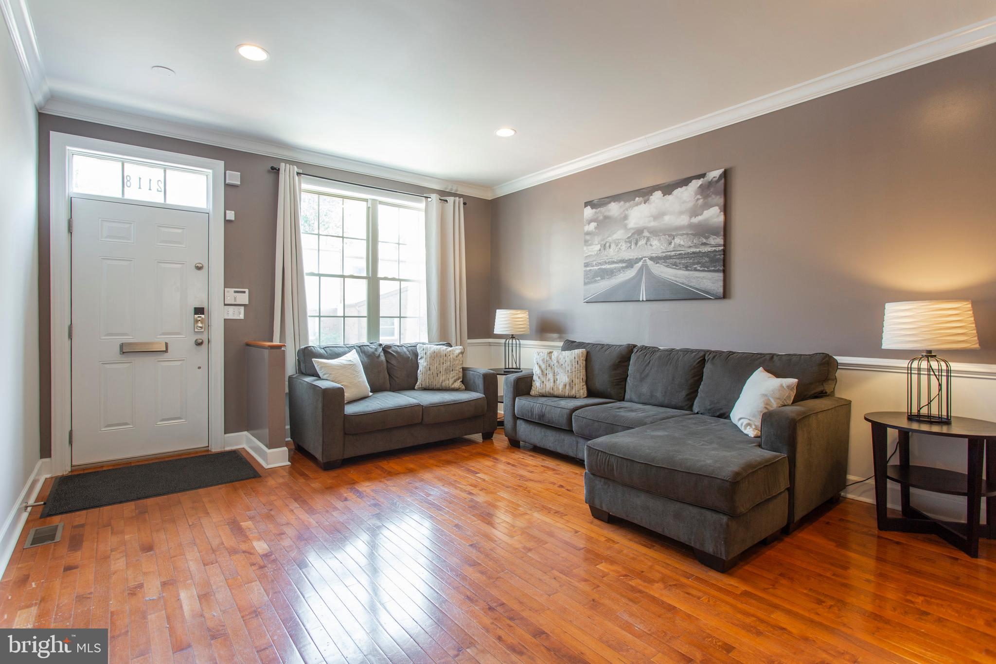 2118 Ellsworth Street Philadelphia, PA 19146 - Photo 5 of 32 a living room with furniture and a window
