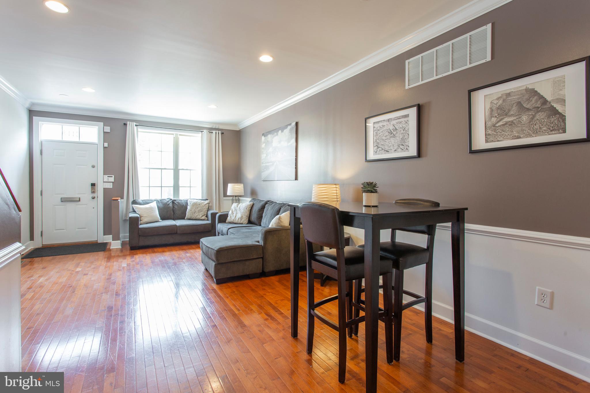 2118 Ellsworth Street Philadelphia, PA 19146 - Photo 6 of 32 a living room with furniture and a wooden floor