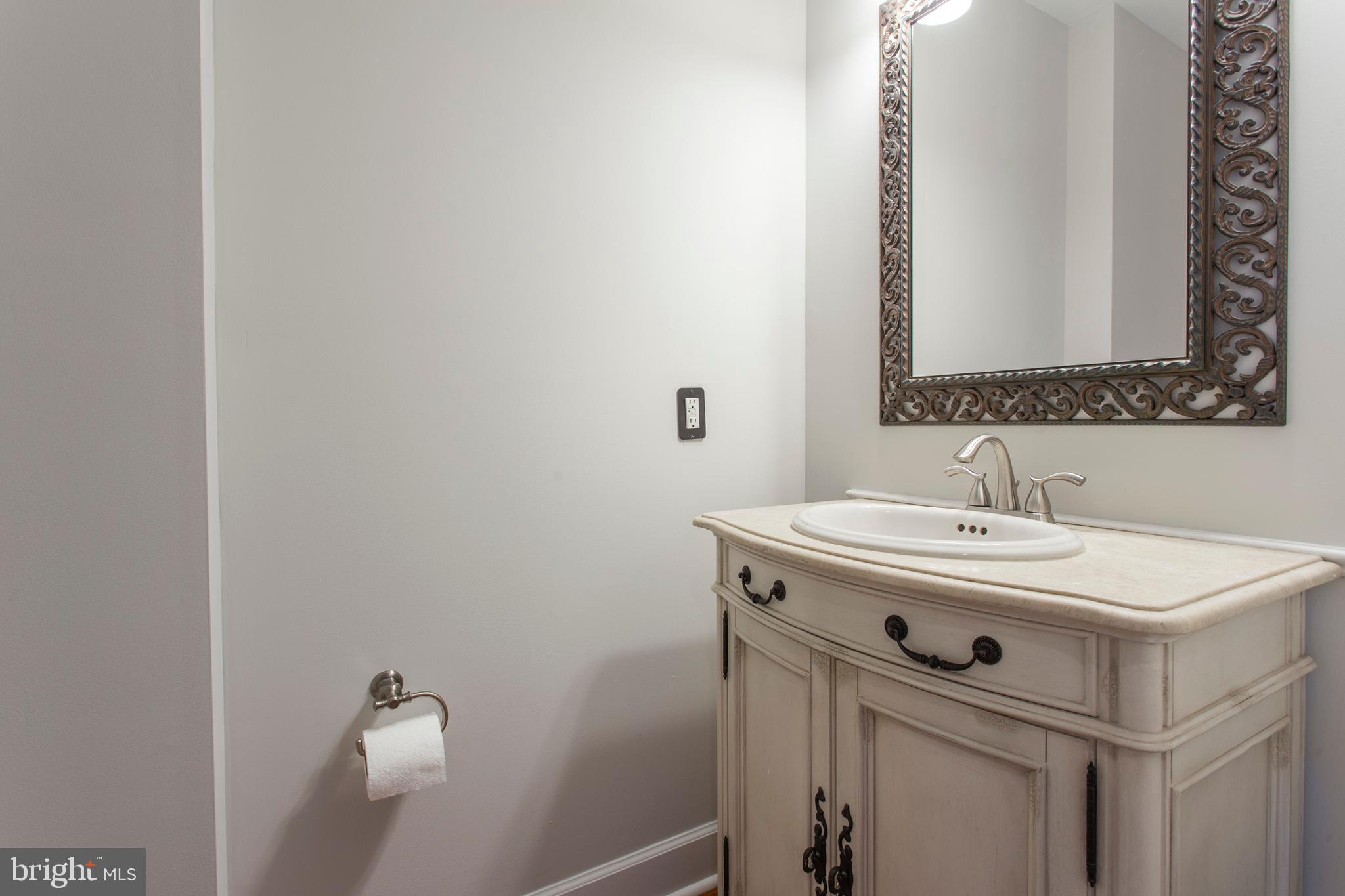 2118 Ellsworth Street Philadelphia, PA 19146 - Photo 8 of 32 a bathroom with a sink and a mirror