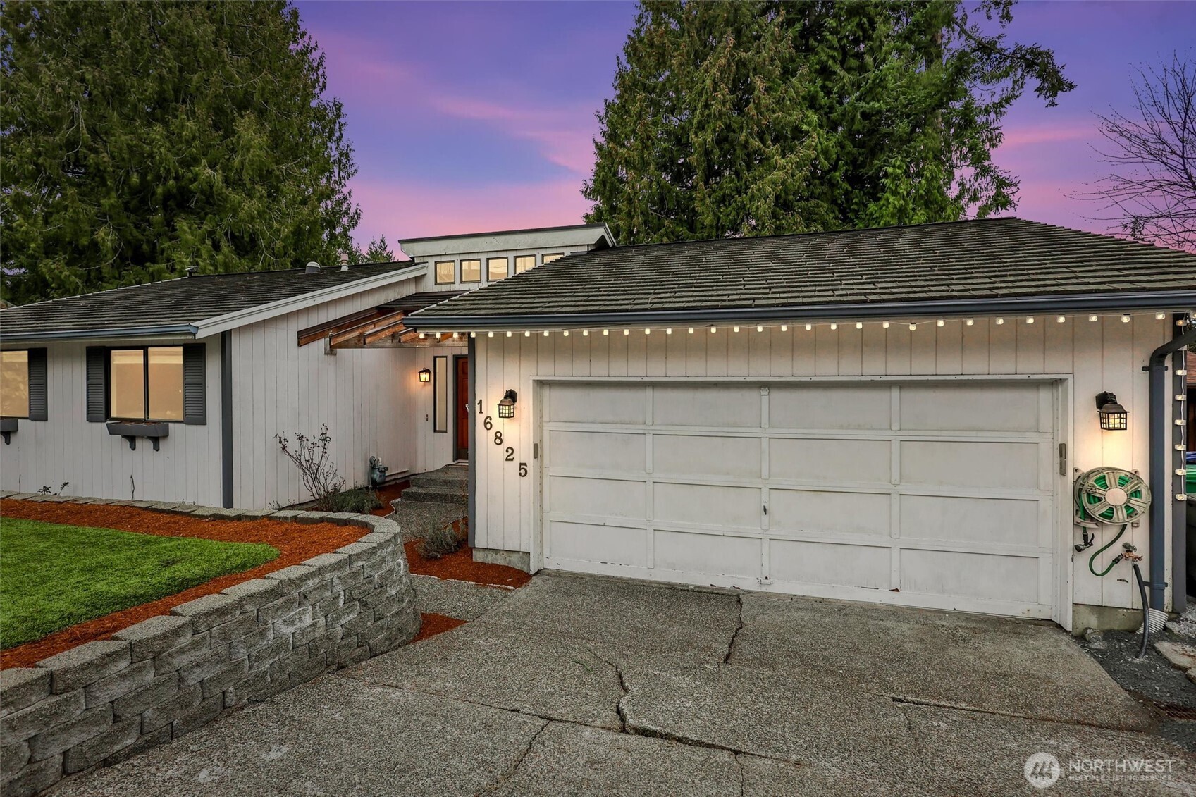 16825 17th Avenue Southeast Bothell, WA 98012 - Photo 2 of 37 a front view of a house with a yard
