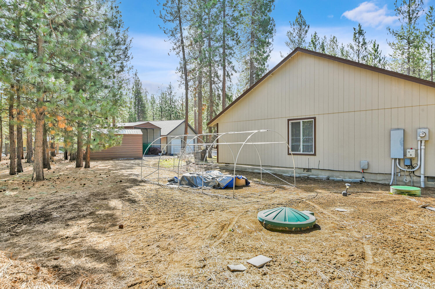 14840 Laurel Road La Pine, OR 97739 - Photo 31 of 32 a backyard of a house with table and chairs