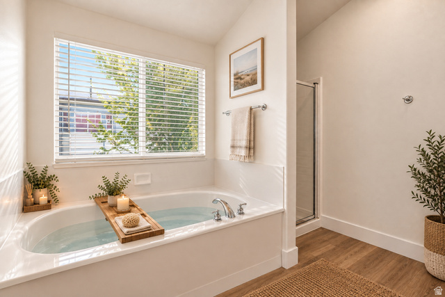 14771 Haddington Road Draper, UT 84020 - Photo 21 of 48 Soaking tub with chrome fixtures, wood-finish flooring, and a glass-enclosed shower