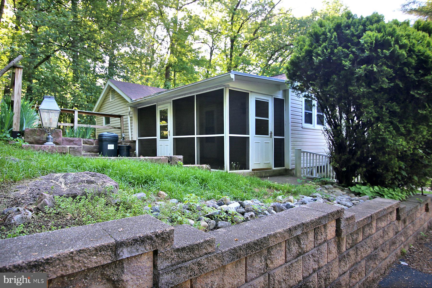1061 Mine Road Lebanon, PA 17042 - Photo 9 of 88 Screened porch and hardscaped patio-1055