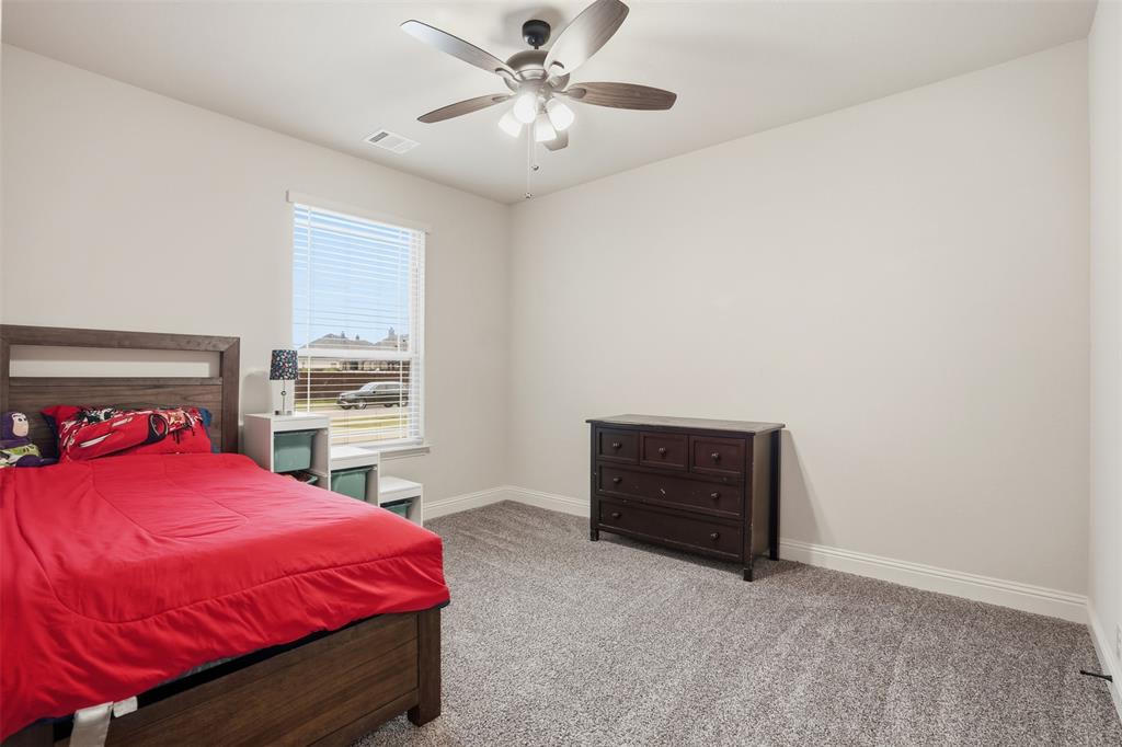 4002 Grove Valley Road Midlothian, TX 76065 - Photo 26 of 40 a bedroom with a bed and a window