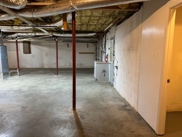 a view of a room with wooden walls