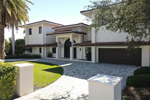 a view of a house with swimming pool and a yard