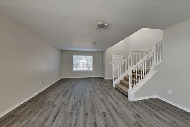 a view of entryway with wooden floor