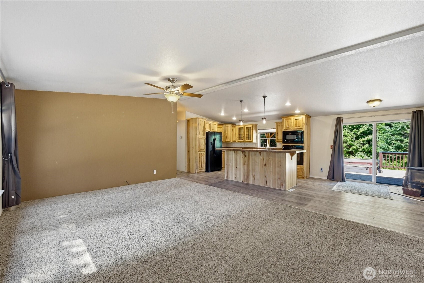 1142 Driskill Road Newport, WA 99156 - Photo 8 of 40 a view of empty room with wooden floor and windows
