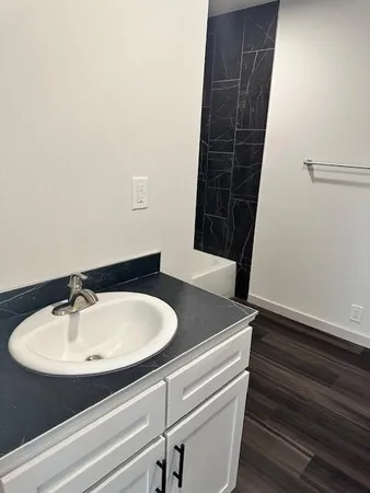 a bathroom with a sink and a mirror