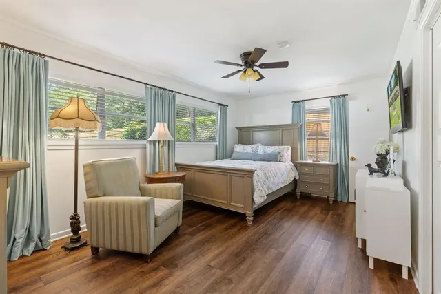 a bedroom with a bed and a couch